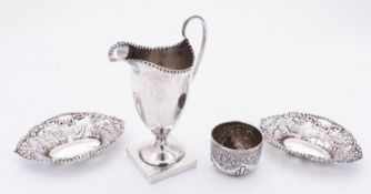 A Victorian silver helmet shaped cream jug by George Nathan & Ridley Hayes, Chester 1896,