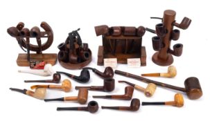 A mixed collection of Briar pipes and holders. Various makers including St Claude and Ogdens etc.