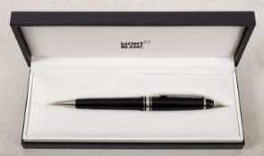 A cased Montblanc Meistertuck roller ball pen.