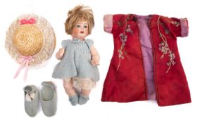 A German porcelain bisque head doll.
