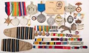 A WWI, WWII and later collection of medals and badges.