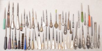A collection of silver and mother of pearl handled Stilletos.
