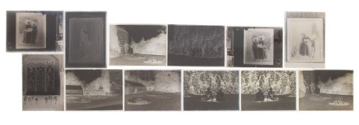 A small collection of early 20th century half plate and three-quarter plate glass negatives,