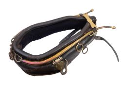A leather and brass working horse collar.