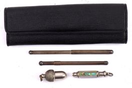Two sterling silver champagne stirrers, together with two propelling pencils,
