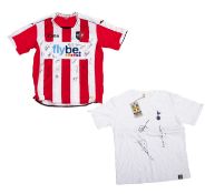 Two signed football shirts.