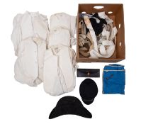 A collection of early 20th century men's white dress shirts and collars,