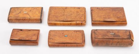 A collection of six burr walnut snuff boxes. Three with inlaid cartouches to the lid.