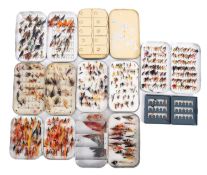 A collection of fly fishing ties in aluminium tins.