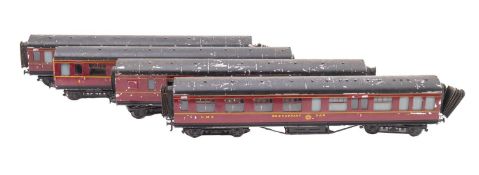 Four O gauge LMS carriages.