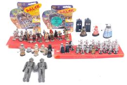 A collection of cast metal Dr Who figures.