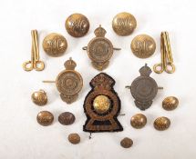 A set of twelve Royal Automobile Club gilt brass buttons together with three cap badges and a