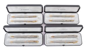 A collection of four Parker pen and pencil sets.