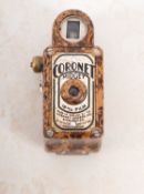 A Cornet 'Midget' brown Bakelite miniature camera in a mottled brown finish,
