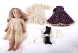 An early 20th century Continental bisque head doll.