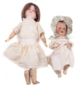 A Heubach Kopplesdorf bisque head doll, remains of brown wig over blue glass sleeping eyes ,