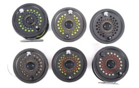 A collection of six Magnum 200D fly fishing reels. Noting three disc drag versions, all unboxed.