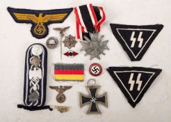 A mixed collection of WWII and later German badges.