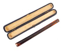 A 9ct gold mounted cheroot holder, having a celluloid body, the end marked '9CT' and in box.