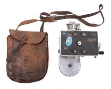 A 'Set Right' ticket machine together with a leather cash bag and an unused ticket roll.
