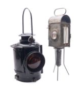 An Adlake Non sweating lamp, with orange colour lens and original burner,