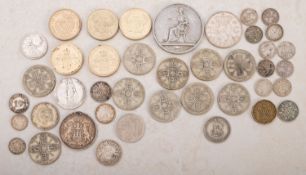 A group of mainly silver coins, including pre 1947 silver 3d, 1920 Uruguay 20 cent,