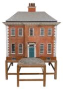 An early 20th century Georgian style Dolls House.