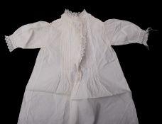 A small group of various whiteware , including three christening gowns, dresses and bonnets etc.