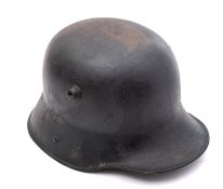 A WWI period German M1916 Stahlhelm, hand painted camouflage finish with white leather liner,