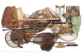 A mixed collection of fishing nets and accessories.
