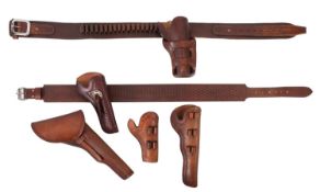 A collection of reproduction leather pistol holsters in 19th century style.