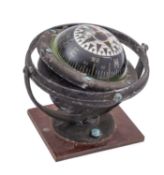 A mid-20th century German 3 inch liquid filled gimballed compass, unsigned,