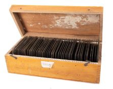 A box of early 20th century quarter plate negatives,