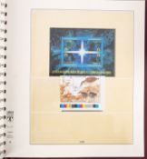 Four albums of Cocos keely stamps.