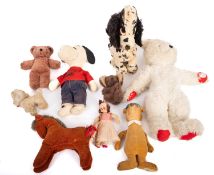 A collection of vintage teddy bears. Noting Merrythought dog and yogi bear etc.