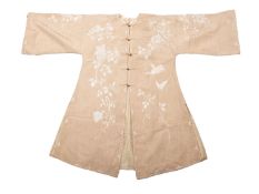 An early 20th century Chinese cream silk and cotton Mandarin jacket,