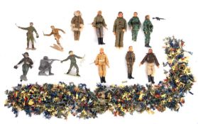 Louis Marx and others. A collection of various scale plastic soldiers and action figures.