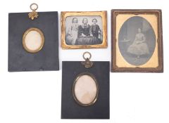 Two Victorian ambrotype portraits, together with two ebony and gilt metal miniature frames.