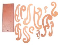 A set of wooden French drawing curves in a mahogany box.
