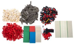 A collection of loose Lego, comprising bricks, wheels,