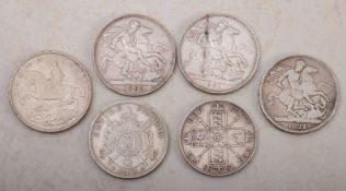 A group of crowns, 1935, 1891, 1895 LIX, 1821, a 1888 double Florin and 1870 five Franc.