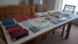 A collection of Singapore/Malaysia stamps in albums and an accumulation of UK and world stamps.