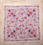 A late Victorian floral embroidered silk shawl,