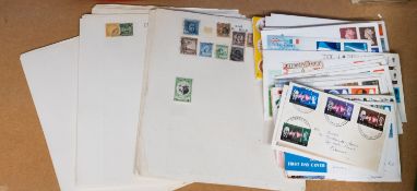 A schoolboy accumulation of stamps in albums and loose with some FDCs .