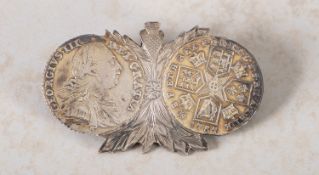 Two 1787 Shillings mounted as a brooch.