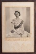 A signed photograph of Queen Elizabeth II by Dorothy Wilding dated 1956.
