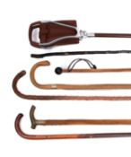 A Gamebird brown leather shooting stick, together with a group of five various walking sticks.