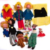 A collection of wooden ventriloquist puppets.