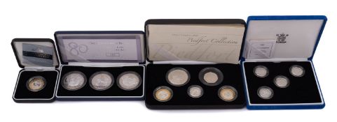 A Royal Mint Queens 80th birthday crown set, five silver proof mint £1 coins,