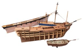 Three part finished wooden scale models of sailing ships.